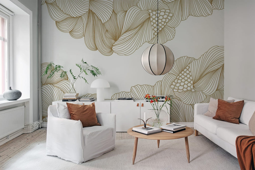 Opulent Beauty, Wallpaper in Gold featured on a wall of a living area with white sofa set and a round wooden table several books and wooden vase on top.