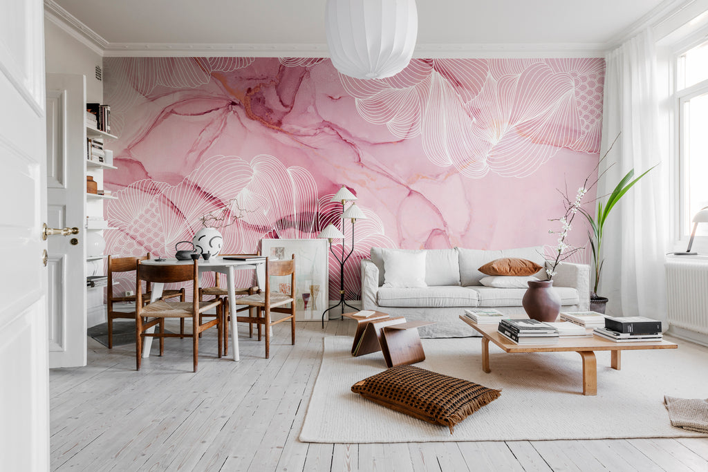 Opulent Beauty, Wallpaper in Magenta featured on a wall of a living area with white sofa, wooden cofee table, a dining set and several pillows on the couch and on the floor.
