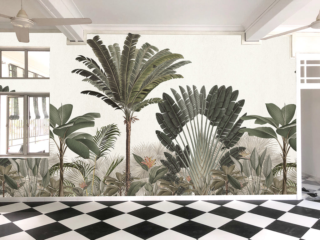 Room adorned with Palm Paradise, Tropical Mural Wallpaper in Green, featuring lush palm trees and tropical foliage in vibrant green hues against a light backdrop, creating a serene, tropical oasis.