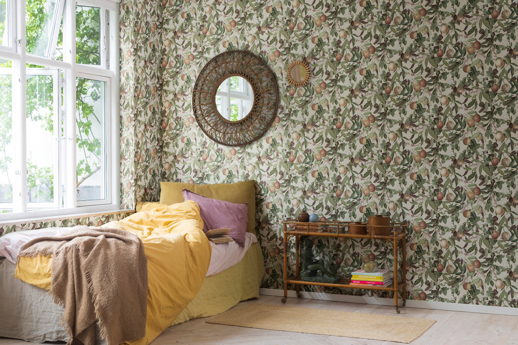 Peach Valley, Floral Pattern Wallpaper in honey, as seen in cozy bedroom with rattan side table and mirror