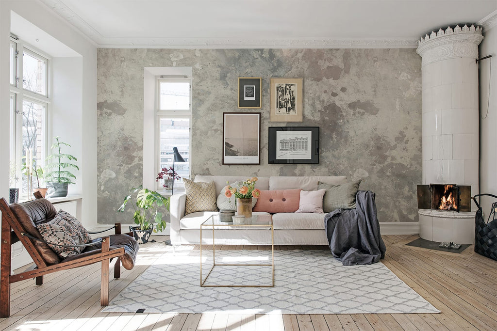 Petinea, Grey Wallpaper featured on a wall of a living area with white sofa that has grey fabric on it, and wood flooring