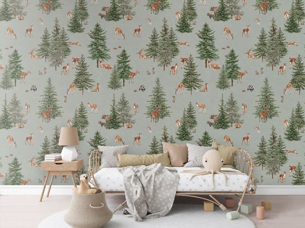 Pine forest, Pattern Wallpaper in blue colourway. The room features a cozy reading nook with a comfy armchair, a small wooden bookshelf filled with children's books, and a soft, patterned rug. 
