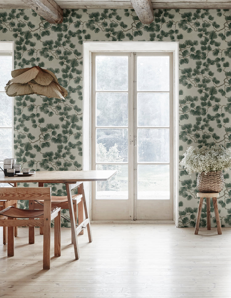 Pine, Wallpaper in green featured in a dining room with wooden flooring and adjacent to the glass panel door giving it a cozy ambiance