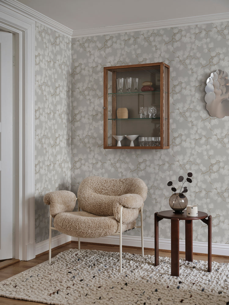 Pine, Wallpaper in white featured in a room with single sofa chair, darkbrown side table, with wooden flooring and a white floor mat