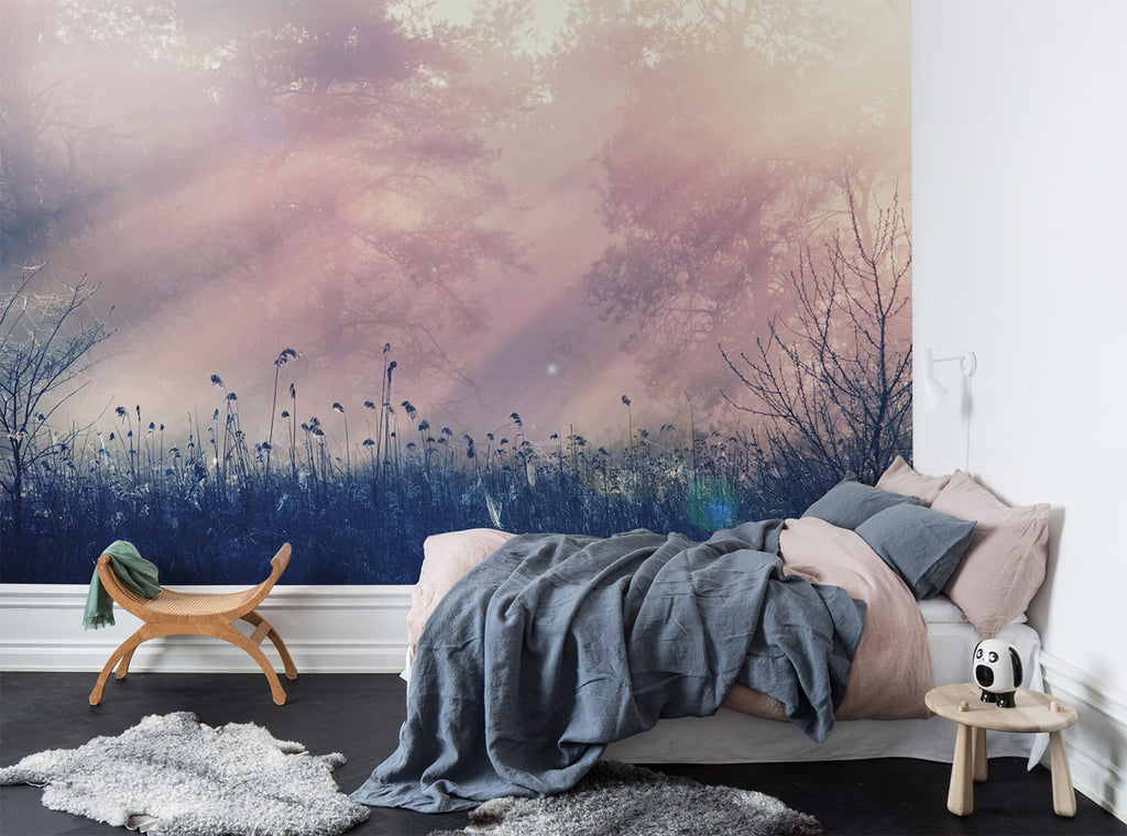Pink Dawn, Mural Wallpaper featured on a wall of a bedroom with pink pillows and sheets with grey fabric, and wooden chair