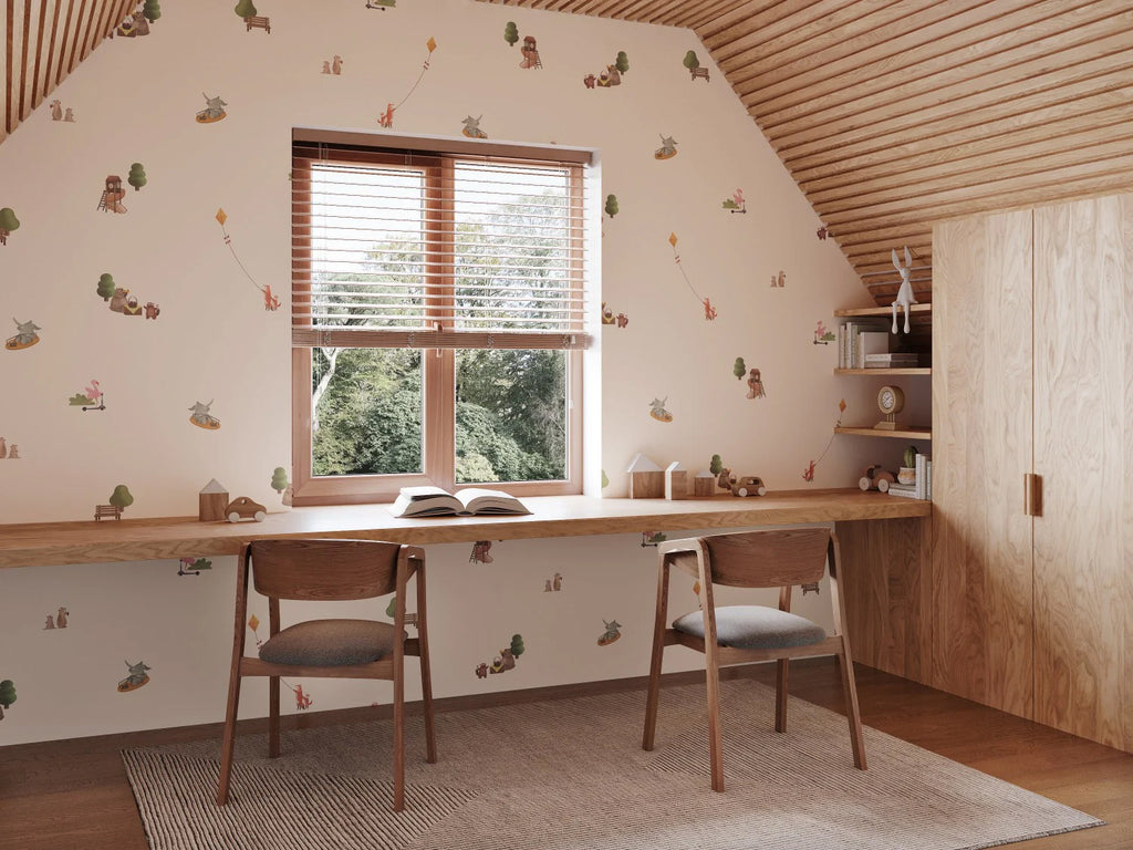 A serene study space with Playground, Animal Patterned Wallpaper. Features a large window, two chairs, a desk with an open book, and a striped rug.