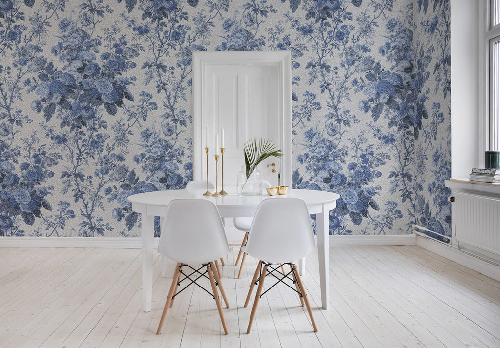Porcelain, Floral Pattern Wallpaper in blue featured on a wall of a dining area with round white table and white chair 