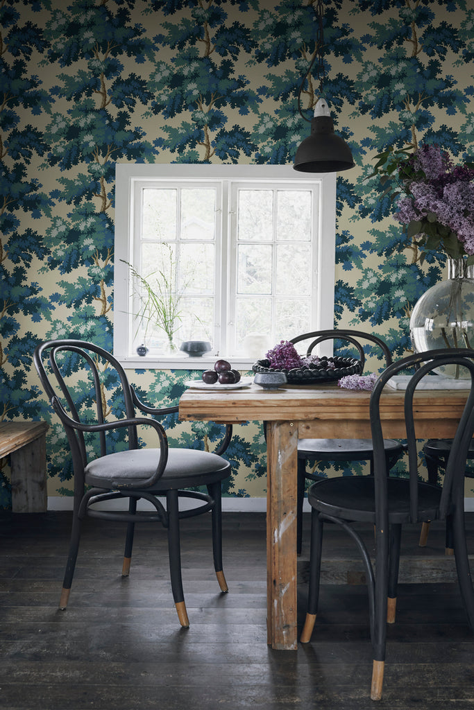 Raphael Floral, Wallpaper in Dark Blue featured on a wall near a window and a wooden table with a black chair