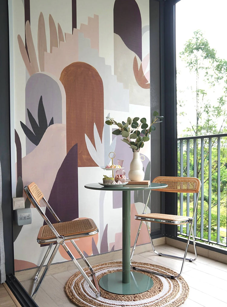 Ressa, Abstract Geometric Wallpaper enhances a serene balconyy. Muted tones cover the wall, complemented by a round table, two chairs, and a view of lush greenery.