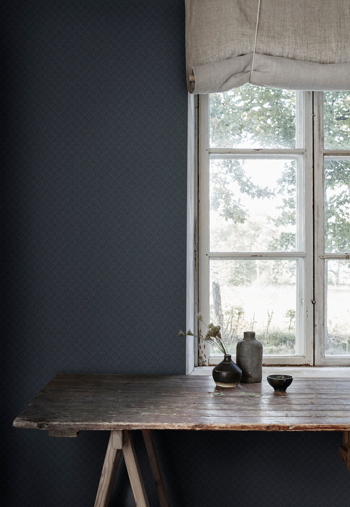 Raphael Floral, Wallpaper in Dark Blue featured on a wall near a window and a wooden table with ceramics on top