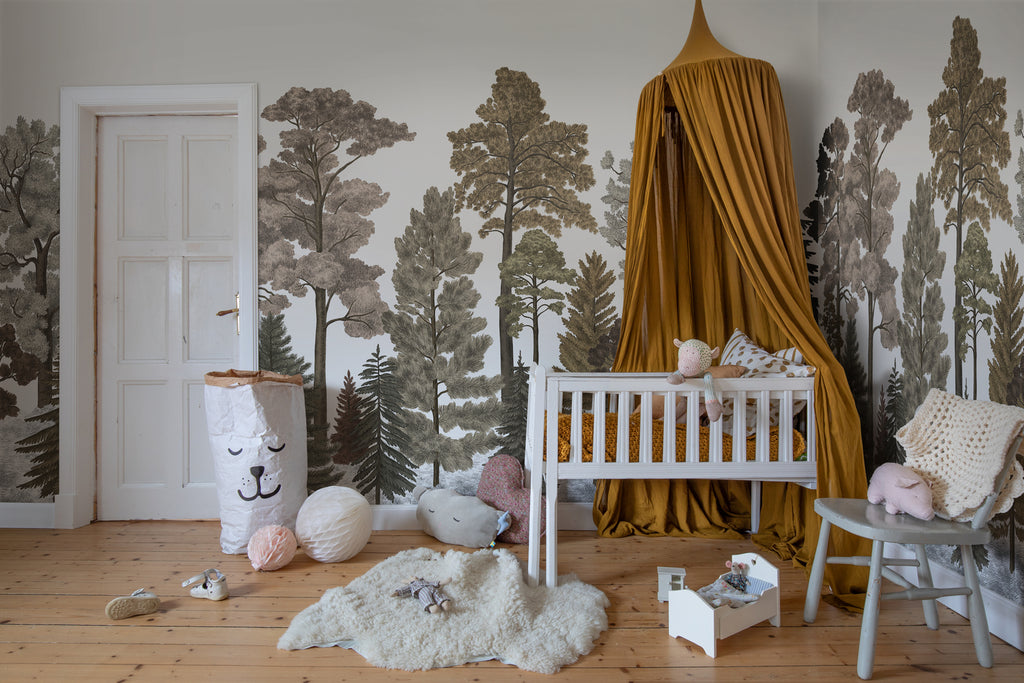Scandinavian Forest, Mural Wallpaper in crimson as seen in child’s playroom with toys and white rug