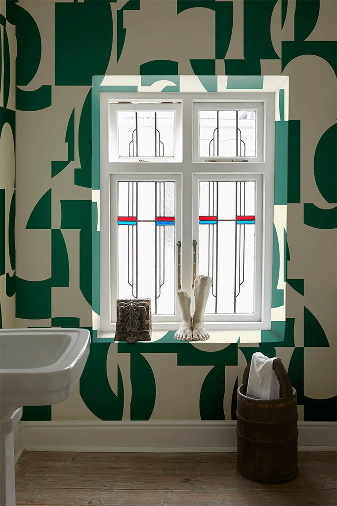 Slow Assembly, Geometric Pattern Wallpaper in Green featured on the wall with a window in a toilet