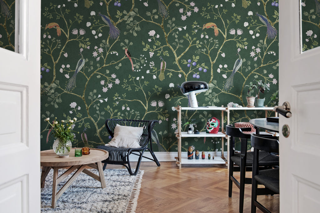 Song Birds, Animal Pattern Wallpaper in green featured on a cozy living area with coffee table and chair