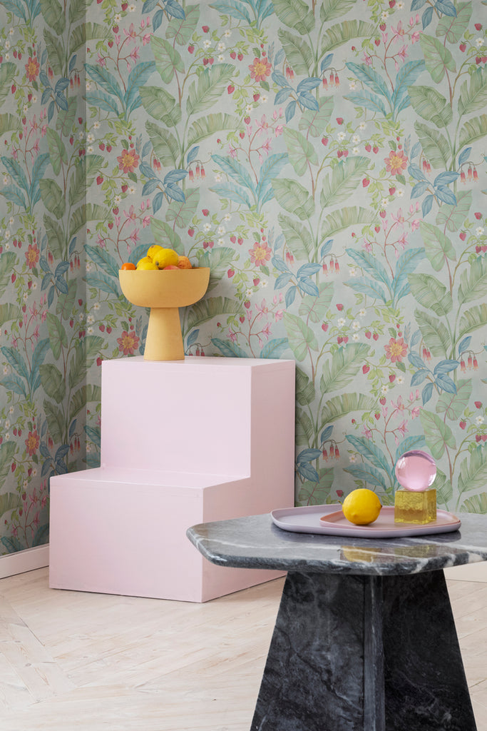 Closed up, Strawberry Lane, Pattern Wallpaper in Green as seen in child’s playroom with marble table and yellow vase