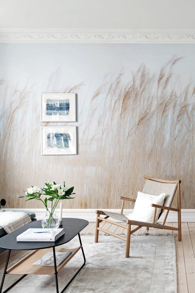 Swaying Reed, Natural Mural Wallpaper featured in a wall of a living area with wooden chair