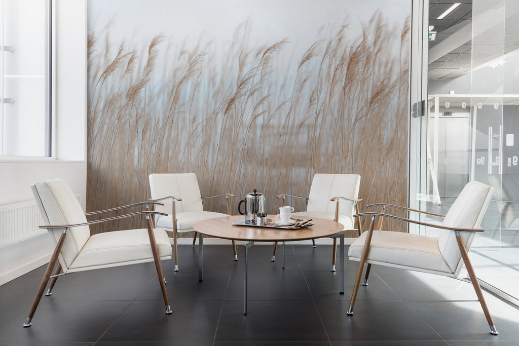 Swaying Reed, Natural Mural Wallpaper featured in a room with modern round table and chairs