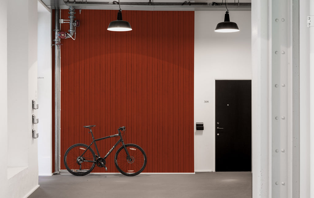 Swiss Cottage, Striped Wallpaper in crimson, featured on a wall of a garage, along with a bike and in a spotlight