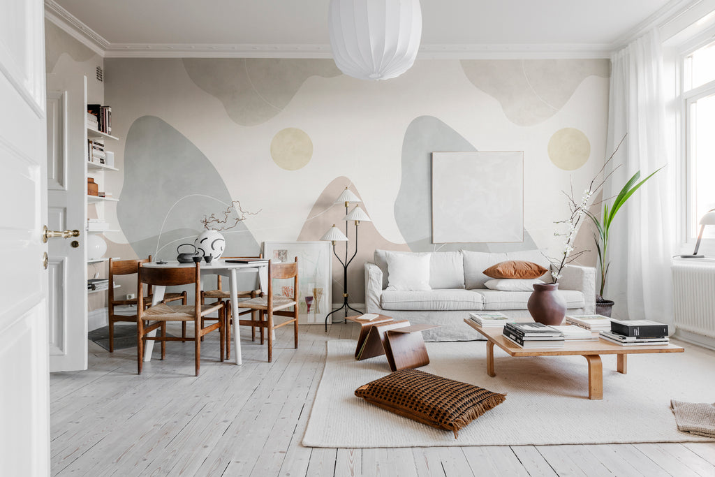 Terrain, Mural Wallpaper graces a cozy living area, where it complements a soft sofa set, dining table and rug, creating an inviting and comfortable atmosphere.