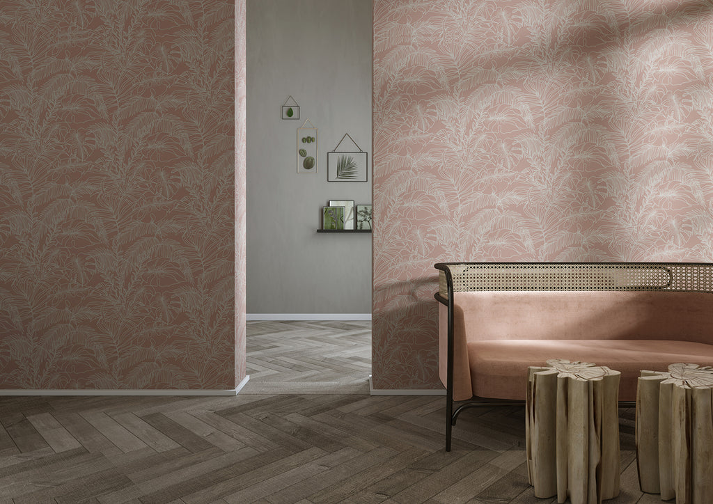 An elegant room with Terre, Tropical Pattern Wallpaper in Terracotta. A modern bench and wooden stools sit on a herringbone floor. An adjacent room with wall shelves holding decorative items is visible.