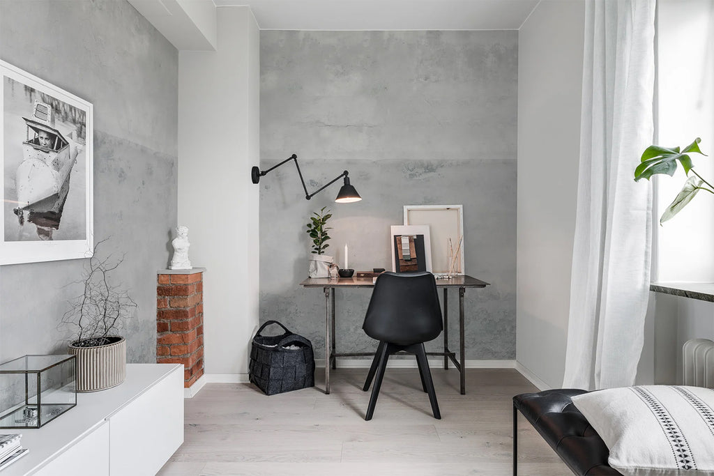 The Horizon, Grey Mural Wallpaper featured on a wall of a cozy room with a study table and black chair 