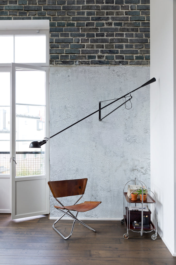 Top Brick Concrete Wall, Faux Texture Wallpaper featured on a wall of a foyer with a director’s chair near a door