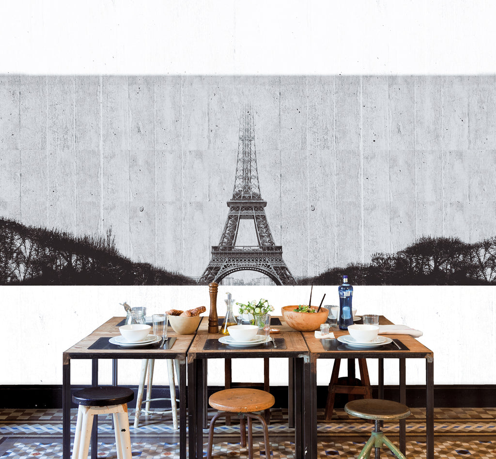 Tres Tintas Paris Eiffel Tower Wallpaper featured in a wall of a wooden dining table with round chairs