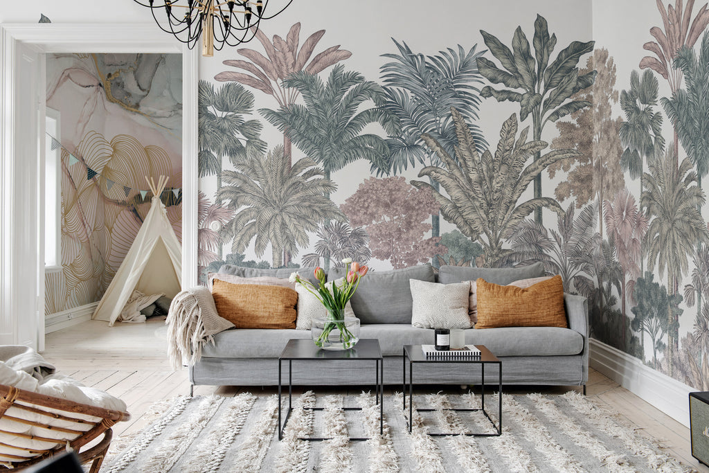 Tropical Bellewood, Mural Wallpaper in multicolor featured in a wall of a living area with grey sofa and soft brown pillows and cushion