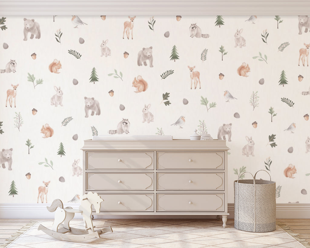 An inviting room adorned with Wild Woods, Animal Pattern Wallpaper, featuring playful animals patterns such as squirrels, deer, bear, rabbit. A white six-drawer dresser, a charming wooden rocking horse, and a woven basket enhance the room’s cozy and elegant ambiance.