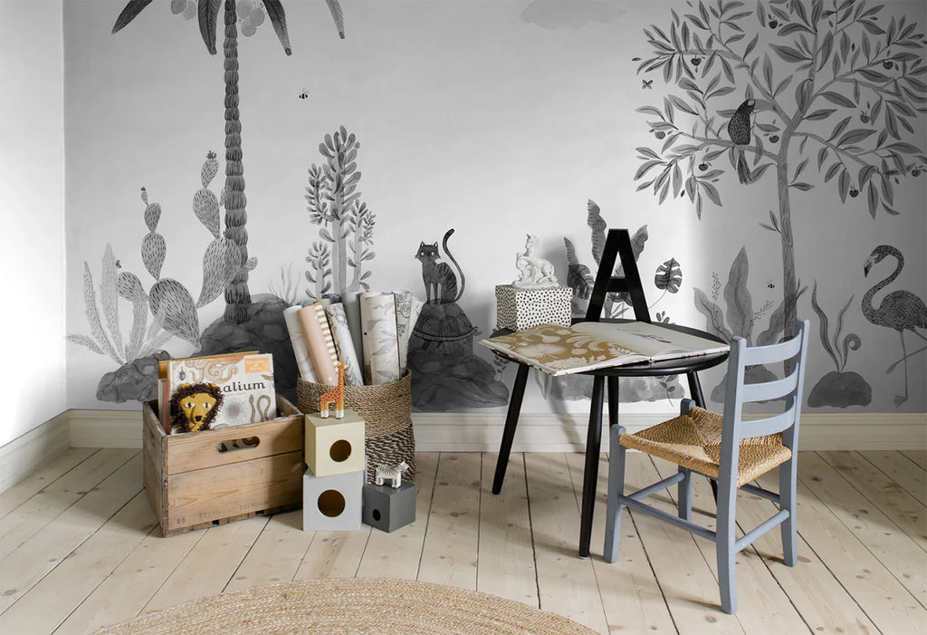 Wilton and Friends, Wallpaper in Dark Grey Featured on a wall of kid’s room with wooden box with several items in it. 