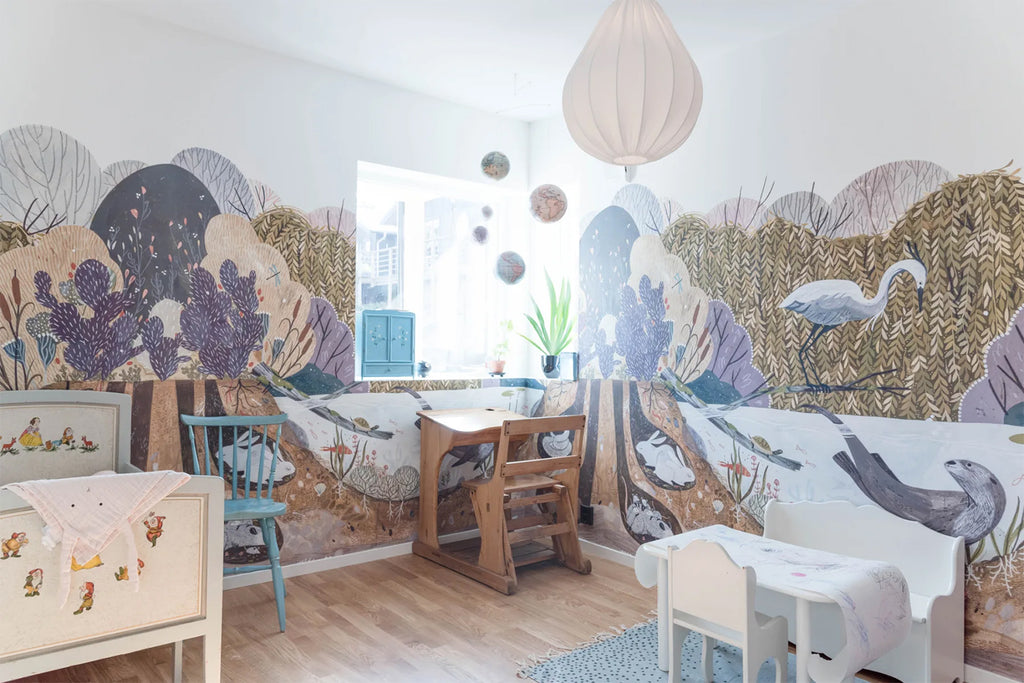 Wild Willows, Animal Mural Wallpaper featured on a nursery room as seen with study table, play table and a white crib
