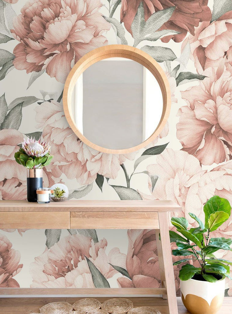 Peonies Garden wallpaper on a wall behind a mirror and a table