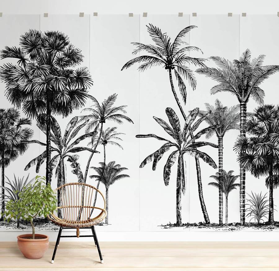 Boho Forest wallpaper in a room with a rattan chair and potted plant.
