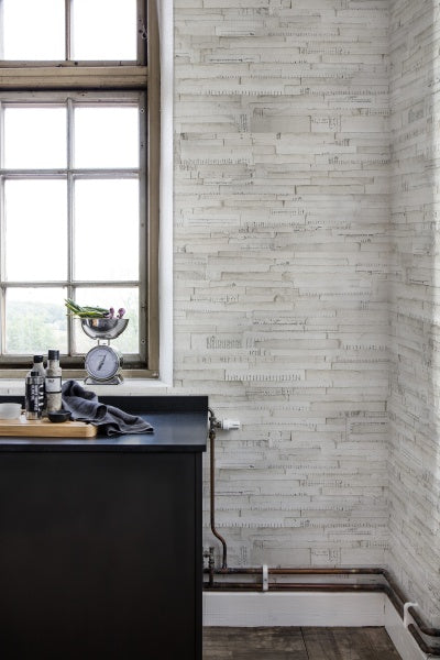 The Library Wallpaper inspired by handwritten paper sheets found in an antiquary