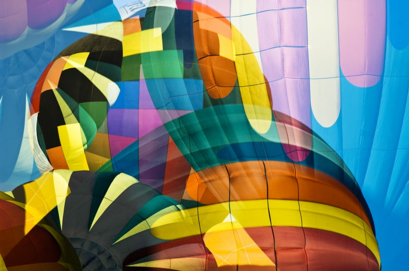 Balloon Flying High Wallpaper with Playful hot air balloons in vibrant colours close up