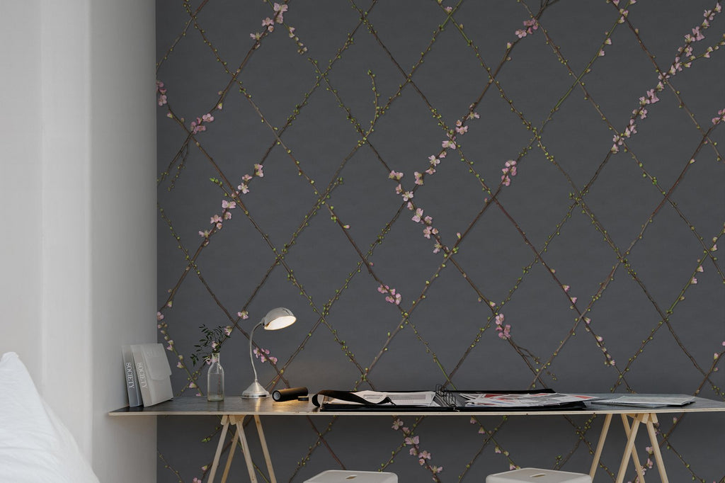Winding Spring Wallpaper features Delicate flowers and small buds creep along diamond-shaped vines set amongst a dark background with study table