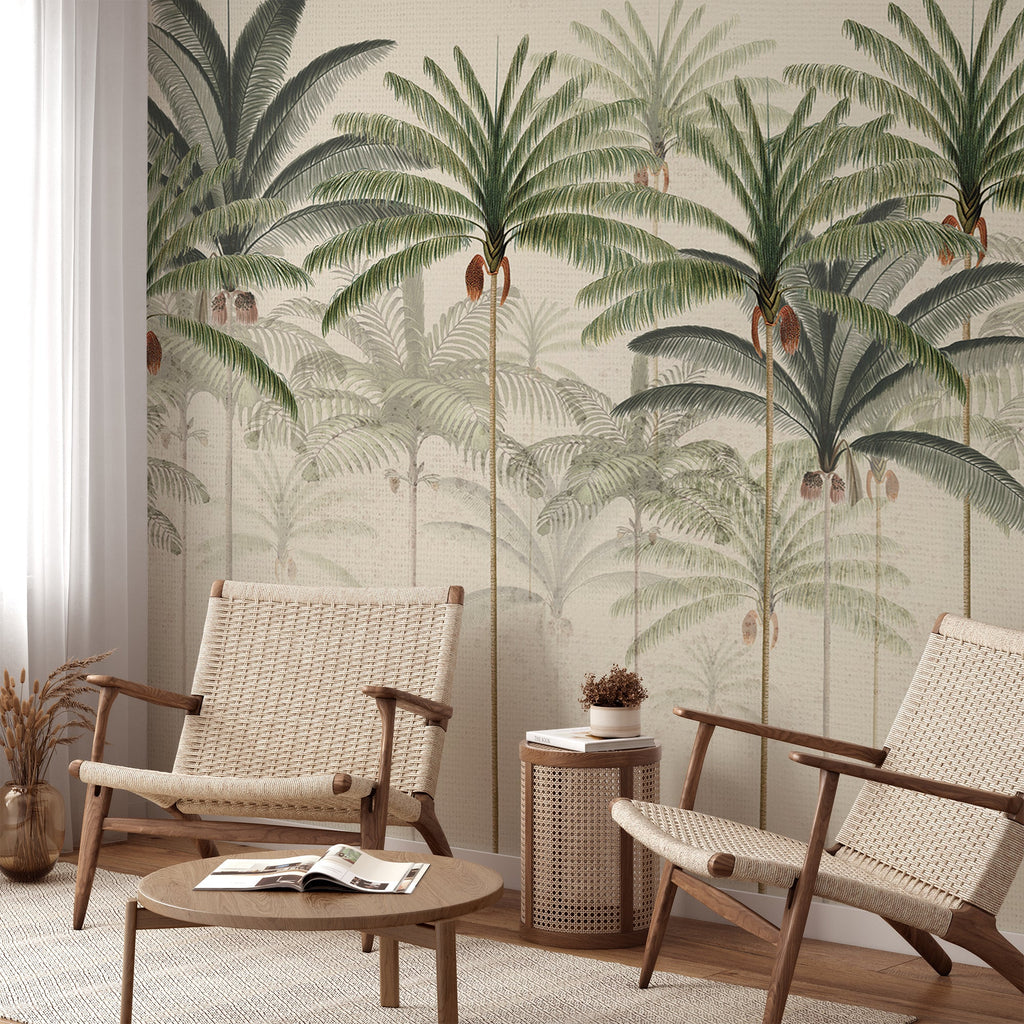 In a room with two rattan chairs and a wooden circular coffee table, the wall is adorned with honey-colored Rainforest Vintage, Mural Wallpaper, complementing the wood flooring.