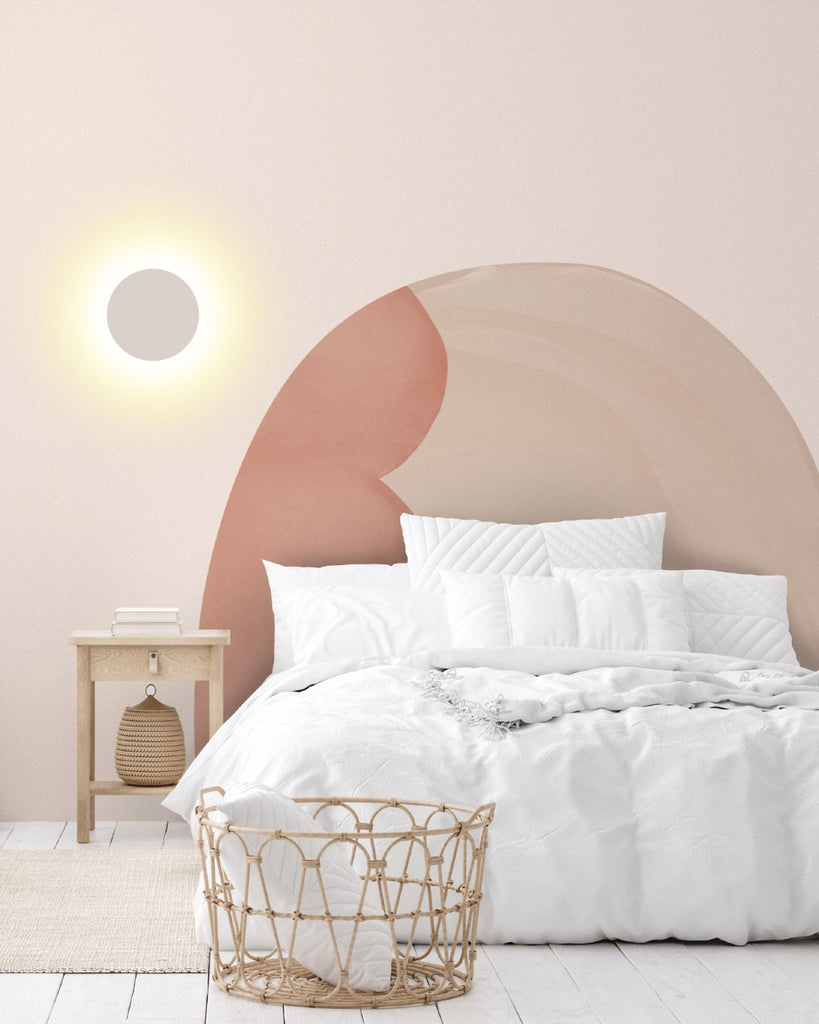 Under the Tuscan Sun, Mural Wallpaper, features a stunning headboard design in warm pink tones, as seen in a bedroom with white bed sheets and wooden floor.