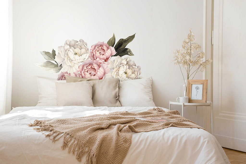 Peonies Pack, Floral Wall Decals, in Blush and White, featured in a comfy bedroom, full of soft sheets and pillows. 