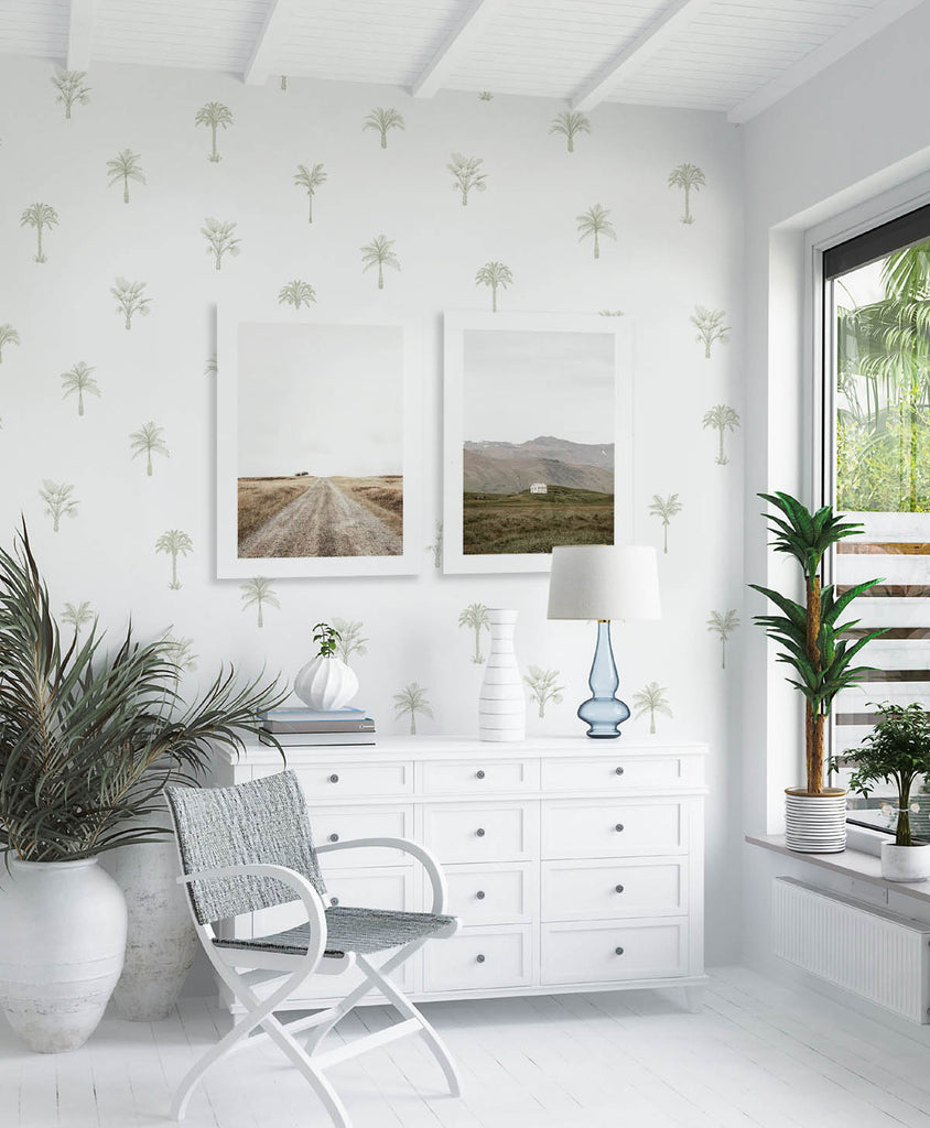 Pamela Palm, Tropical Pattern Wallpaper in green, featured in a natural-lit room full of white furnishing.