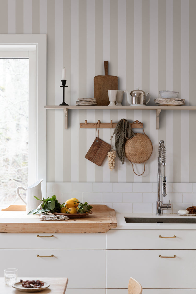 Teira, Striped Wallpaper featured in kitchen area behind the dishwasher and white kitchen cabinets