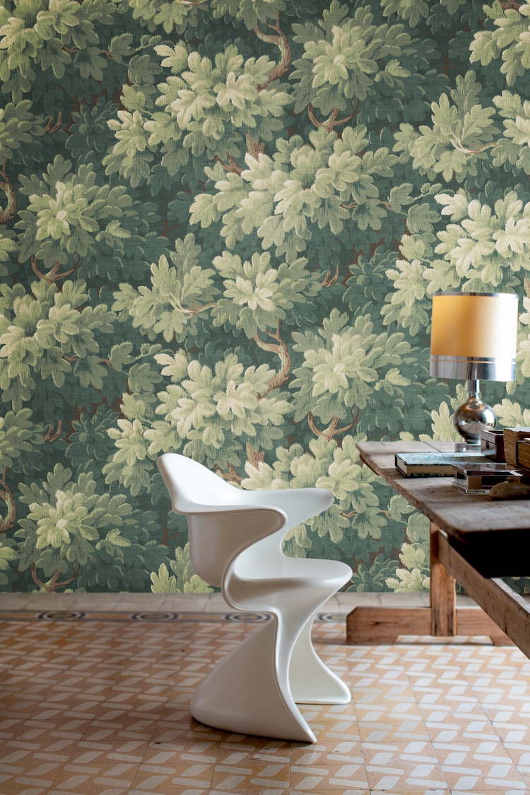 Green botanical wallpaper enhancing focus and calm in a home office
