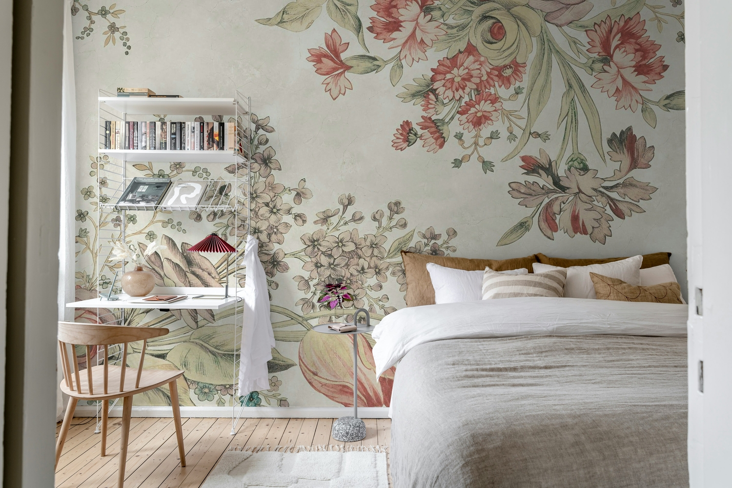 Large floral wallpaper in pink tones adding elegance to a contemporary bedroom