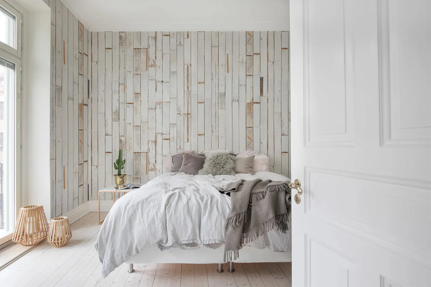 Resort-style room with whitewashed wooden wallpaper panels
