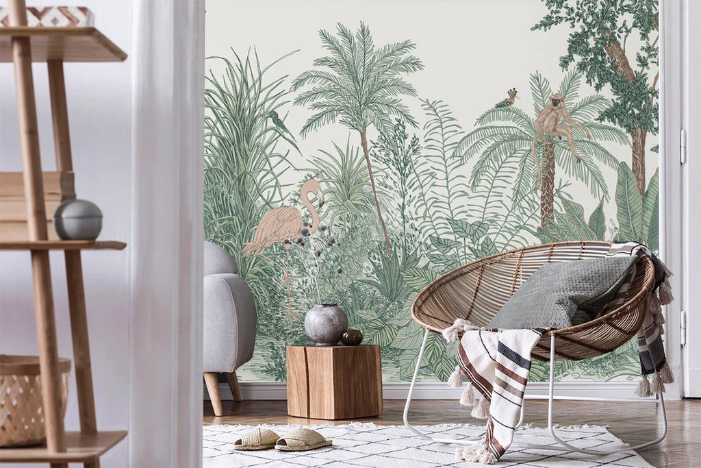 Ara and Friends jungle wallpaper with a flamingo and monkey among sketched green palms and ferns behind a rattan chair and timber shelving