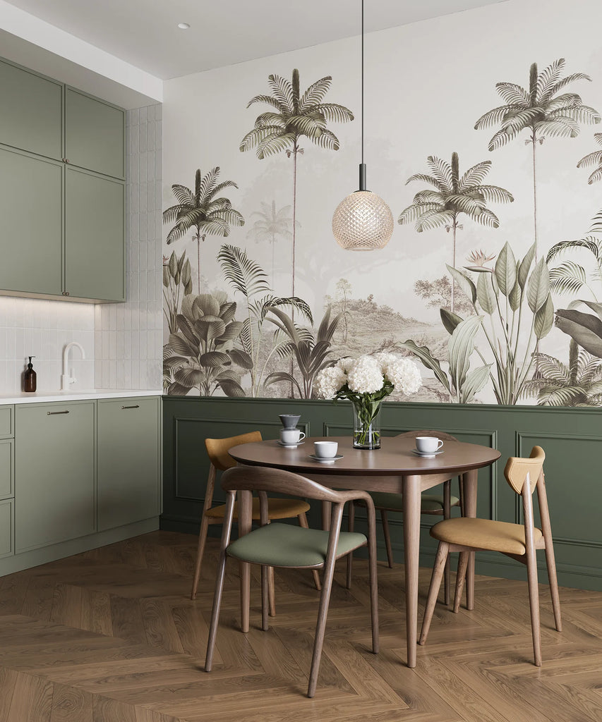 Elegant Rainforest jungle wallpaper with sketched palms and flowering evergreens above a sage green kitchen dining nook with timber chairs