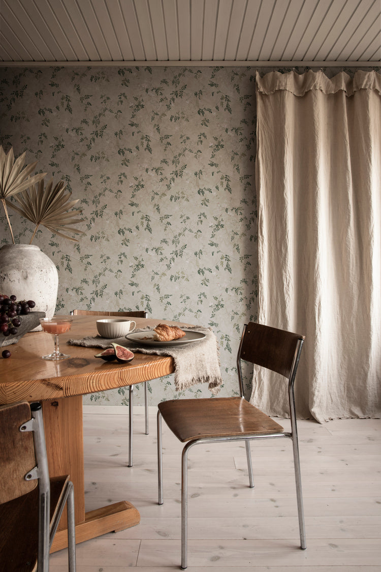 Irene green floral wallpaper setting a sophisticated dining room mood